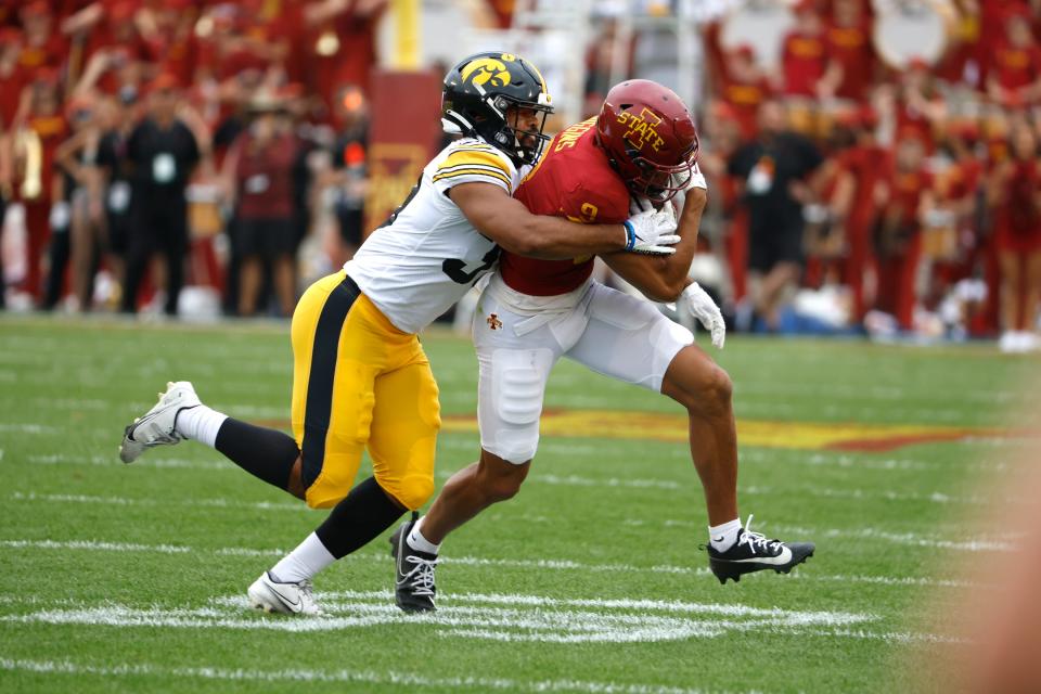 Iowa LB Kyler Fisher (#37) tackles Iowa State wide receiver Jayden Higgins (#9) during Saturday's Cy-Hawk matchup. The Iowa State offense couldn't get it done, losing to Iowa 20-13.