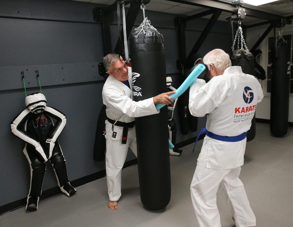 Karate International, based in Exeter, recently expanded its campus to Barrington. Its first adult student was 82-year-old Don Staton. Instructor John English works with him on offense and defense.