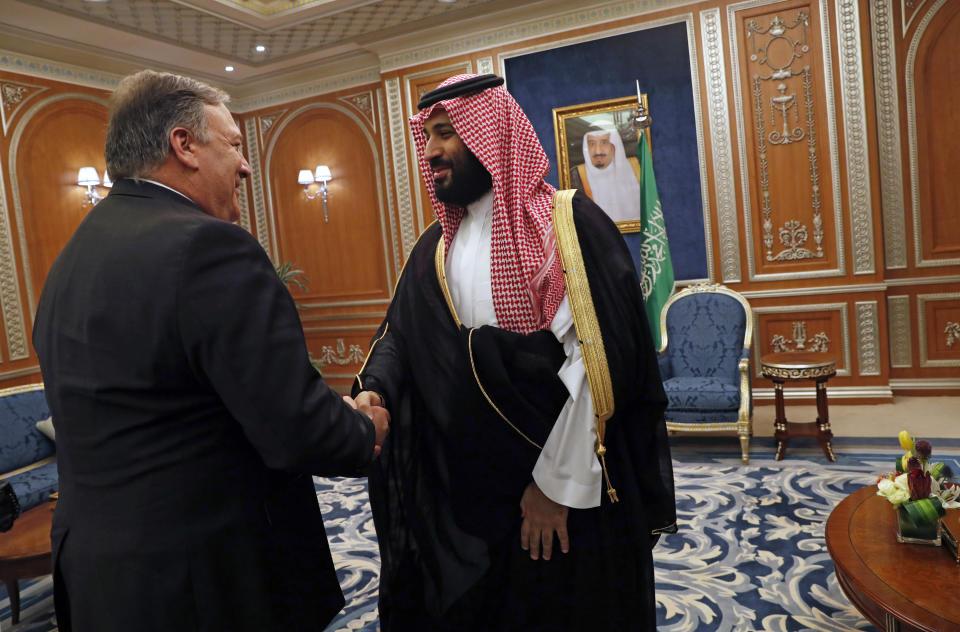 U.S. Secretary of State Mike Pompeo shakes hands with the Saudi Crown Prince Mohammed bin Salman in Riyadh, Saudi Arabia, Tuesday Oct. 16, 2018. Pompeo also met on Tuesday with Saudi King Salman over the disappearance and alleged slaying of Saudi writer Jamal Khashoggi, who vanished two weeks ago during a visit to the Saudi Consulate in Istanbul. (Leah Millis/Pool via AP)