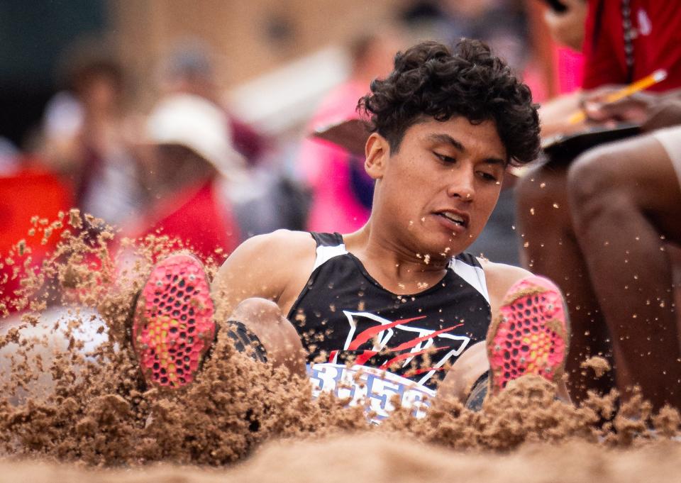 Whitharral's Nomar Gomez hits the dirt in the triple jump during Saturday's Class 1A state track meet. Saturday's competitions ended the three-day UIL state meet at Myers Stadium.
