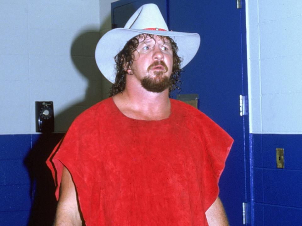 Terry Funk in a white cowboy hat and red shirt