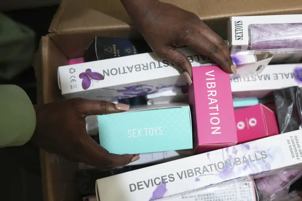 A woman shows a selection of sex toys she sells to women in Zimbabwe, on Friday, June, 23, 2023. (AP Photo/Tsvangirayi Mukwazhi)