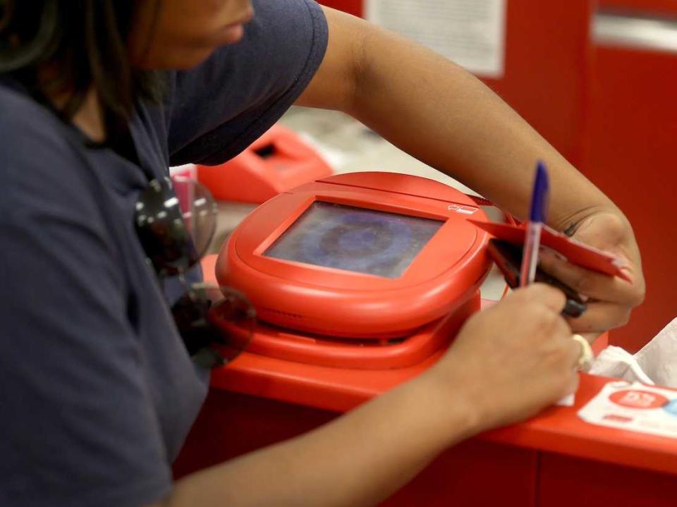 woman paying credit card