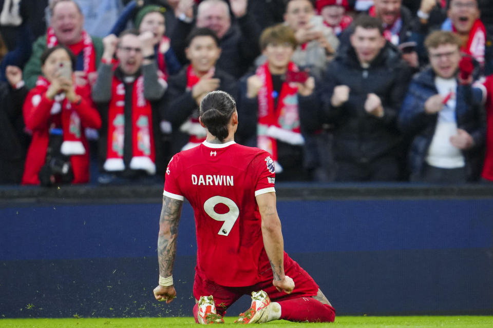 Liverpool's Darwin Nunez celebrates after scoring his side's third goal during the English Premier League soccer match between Liverpool and Burnley, at Anfield stadium in Liverpool, England, Saturday, Feb. 10, 2024. (AP Photo/Jon Super)