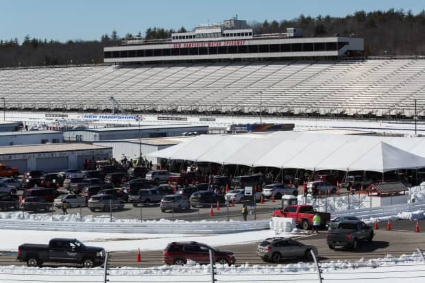 Blue states are ahead in vaccinations. Atop the list is New Hampshire, seen here with a mass vaccination event last month. A whopping 71 per cent of adults in the state, and 58 per cent of the total population, have received at least one dose.