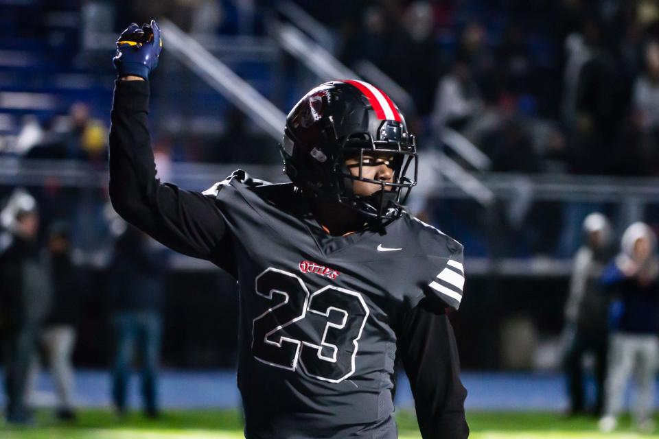 Aliquippa's Tiqwai Hayes signals a touchdown against McKeesport in the WPIAL Class 4A semifinal game Friday at Canon McMillan High School. [Lucy Schaly/For BCT]