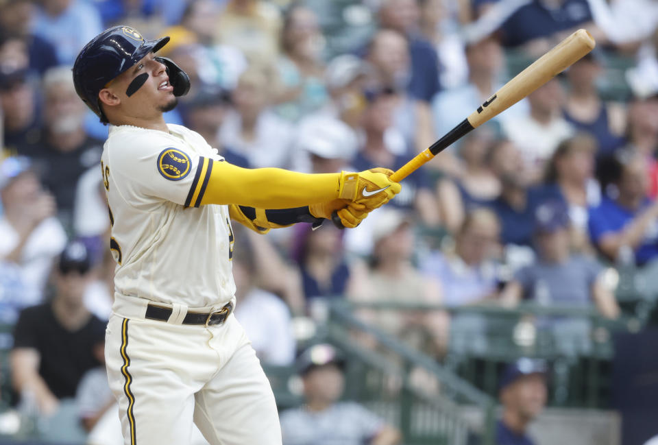 Milwaukee Brewers' William Contreras watches his home run against the Minnesota Twins during the third inning of a baseball game Wednesday, Aug 23, 2023, in Milwaukee. (AP Photo/Jeffrey Phelps)