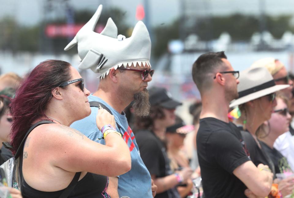 A rock fan in a shark headgear takes in the music at the Rockvillian stage on Friday at the Welcome to Rockville music festival at Daytona International Speedway. The four-day event runs through Sunday in Daytona Beach.
