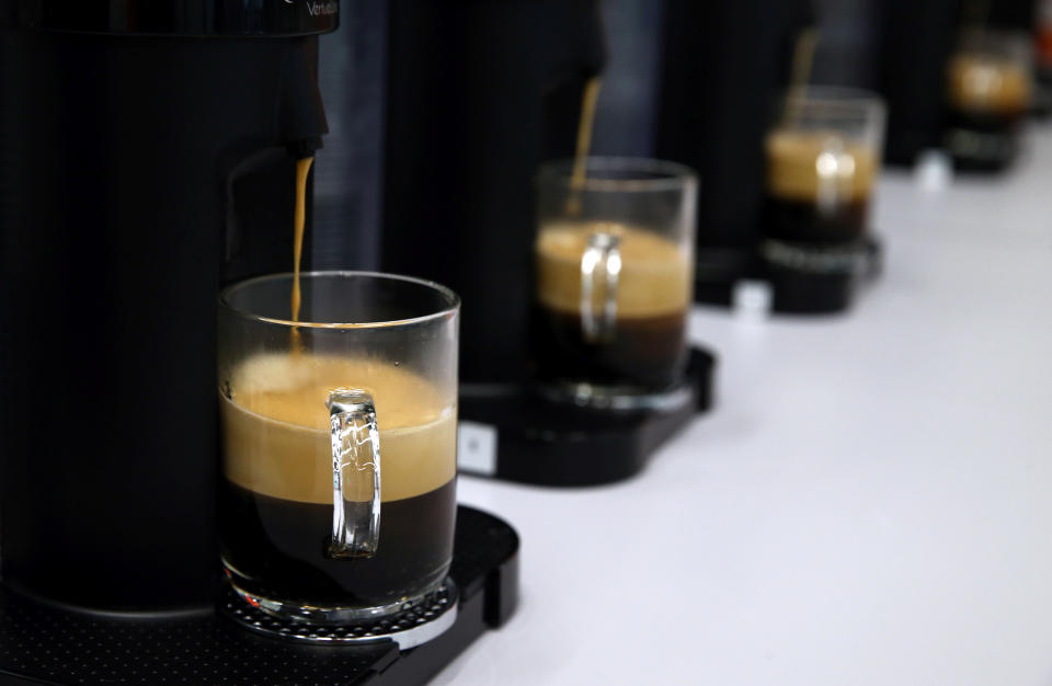 Coffees are poured for a tasting at the Nespresso production plant, part of food giant Nestle, in Romont, Switzerland, August 30, 2016. Picture taken August 30, 2016. REUTERS/Denis Balibouse