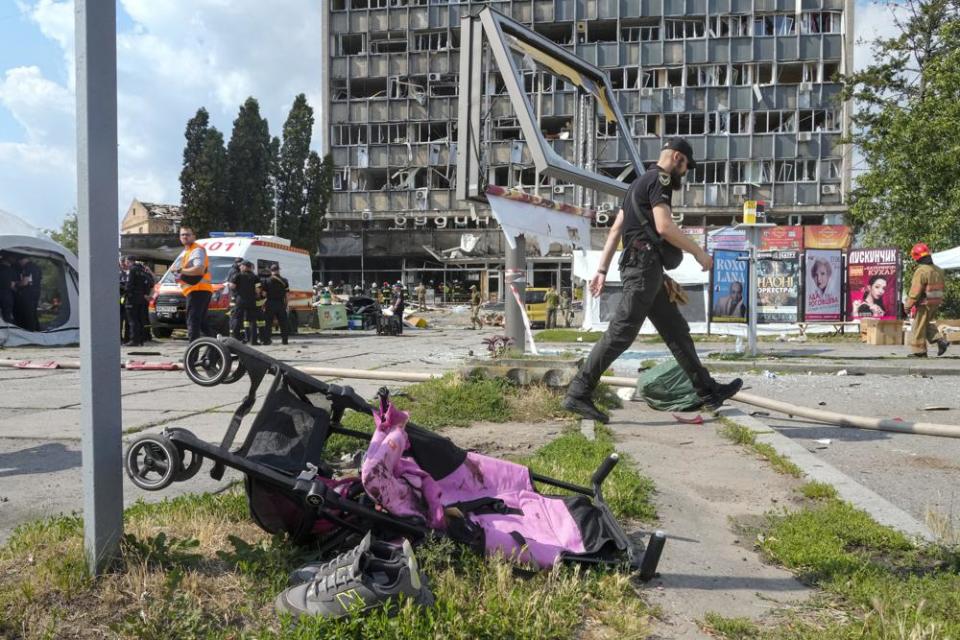 A baby stroller lies by a road after a deadly Russian missile attack in Vinnytsia, Ukraine, Thursday, July 14, 2022.