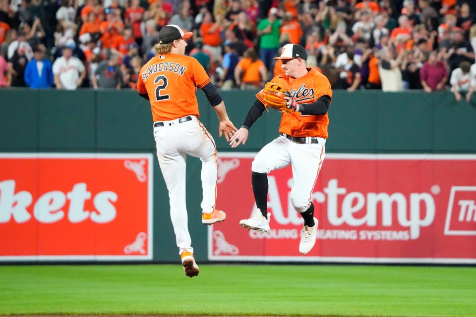 Sep 16, 2023; Baltimore, Maryland, USA; Baltimore Orioles shortstop Gunnar Henderson (2) and Baltimore Orioles left fielder Austin Hays (21) celebrate the victory against the Tampa Bay Rays after the ninth inning at Oriole Park at Camden Yards. Mandatory Credit: Gregory Fisher-USA TODAY Sports