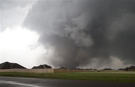 A huge tornado approaches the town of Moore, Oklahoma, near Oklahoma City in this file photo from May 20, 2013. REUTERS/Richard Rowe/Files