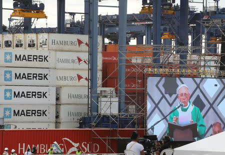 Pope Francis is seen on a screen as he leads a mass at the Contecar harbour in Cartagena, Colombia September 10, 2017. REUTERS/Nacho Doce