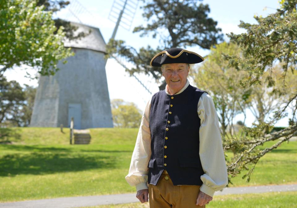 William Cullinane is dressed as Col. Benjamin Godfrey as he stands in front of the Godfrey Windmill. A Revolutionary War memorial will be dedicated Monday near the windmill in Chase Park. Merrily Cassidy/Cape Cod Times