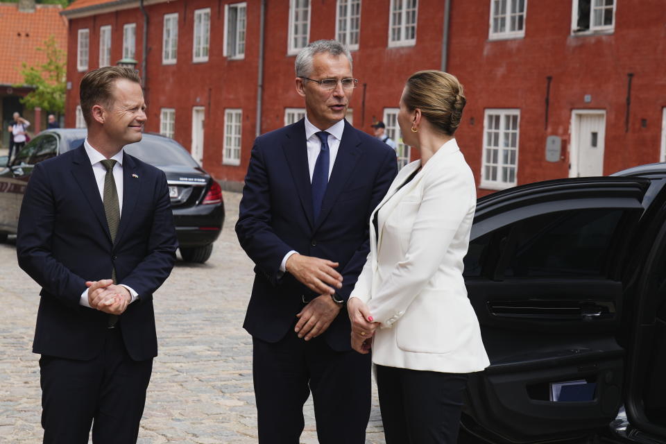 Denmark's Foreign Minister Jeppe Kofod, left, NATO Secretary General Jens Stoltenberg, second left, Danish Prime Minister Mette Frederiksen talk on the occasion of their meeting at Kastellet in Copenhagen, Denmark, Thursday May 19, 2022. (Martin Sylvest/Ritzau Scanpix via AP)