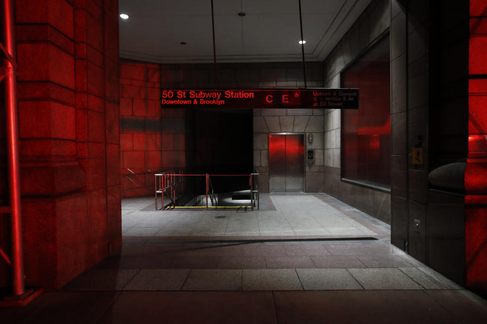 An area leading to the C and E trains at the 50th Street Subway Station is dimly lit during a power outage, Saturday, July 13, 2019, in New York. Authorities were scrambling to restore electricity to Manhattan following a power outage that knocked out Times Square's towering electronic screens and darkened marquees in the theater district and left businesses without electricity, elevators stuck and subway cars stalled. (AP Photo/Michael Owens)