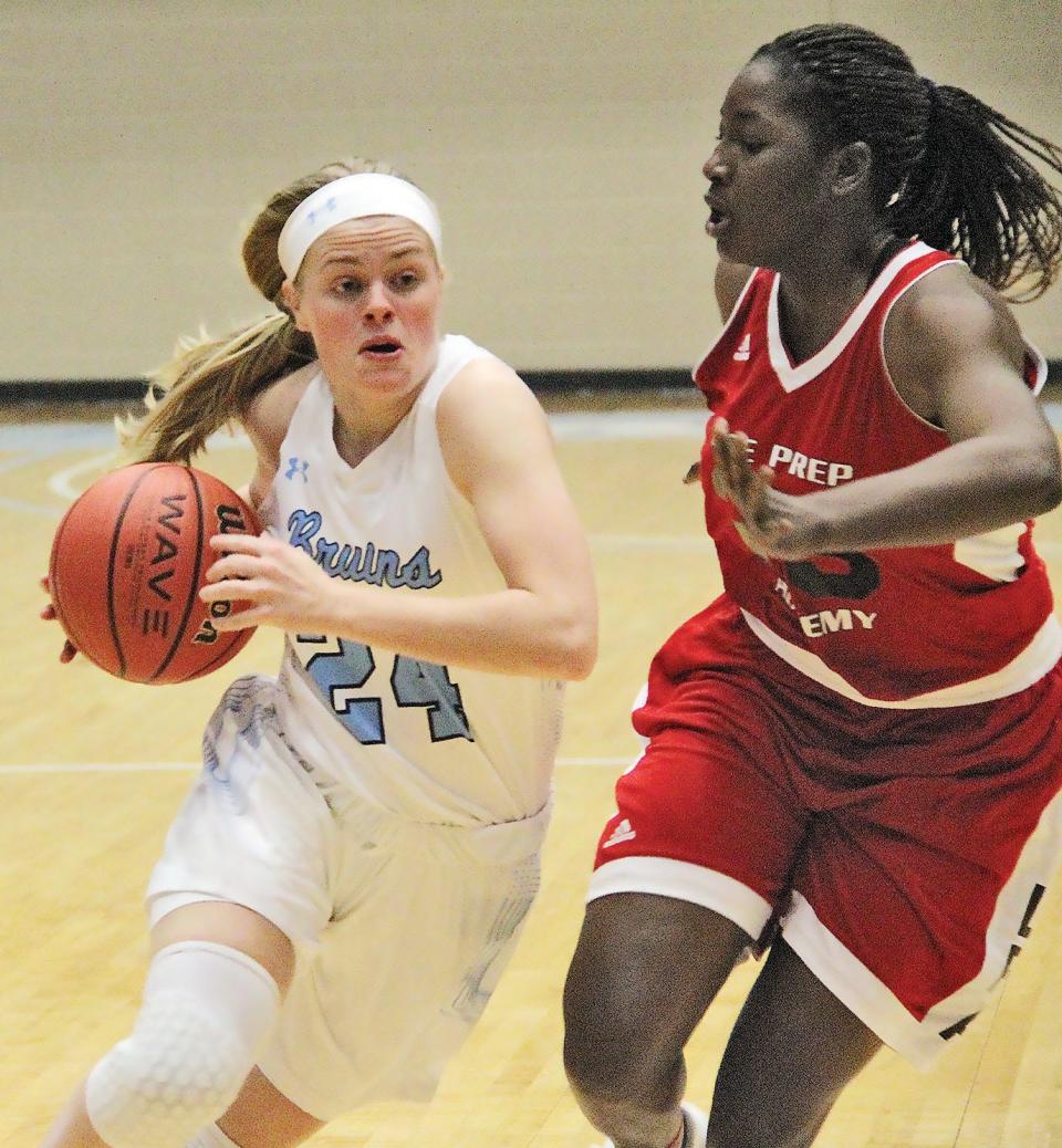 Jena' Williams, left, drives the ball during her Bartlesville High years.