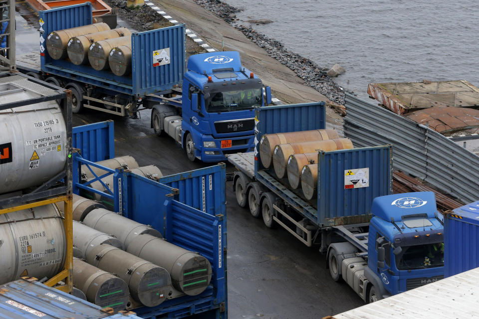 FILE - Trucks carrying containers with uranium to be used as fuel for nuclear reactors line up for loading at a port in St. Petersburg, Russia, Thursday, Nov. 14, 2013. A 20-year program to convert highly enriched uranium from dismantled Russian nuclear weapons into fuel for U.S. power plants has ended, with the final shipment loaded onto a vessel in St. Petersburg's port on that Thursday. The U.S. Energy Department described the program, commonly known as Megatons to Megawatts, as one of the most successful nuclear nonproliferation partnerships ever undertaken. (AP Photo/Dmitry Lovetsky, File)