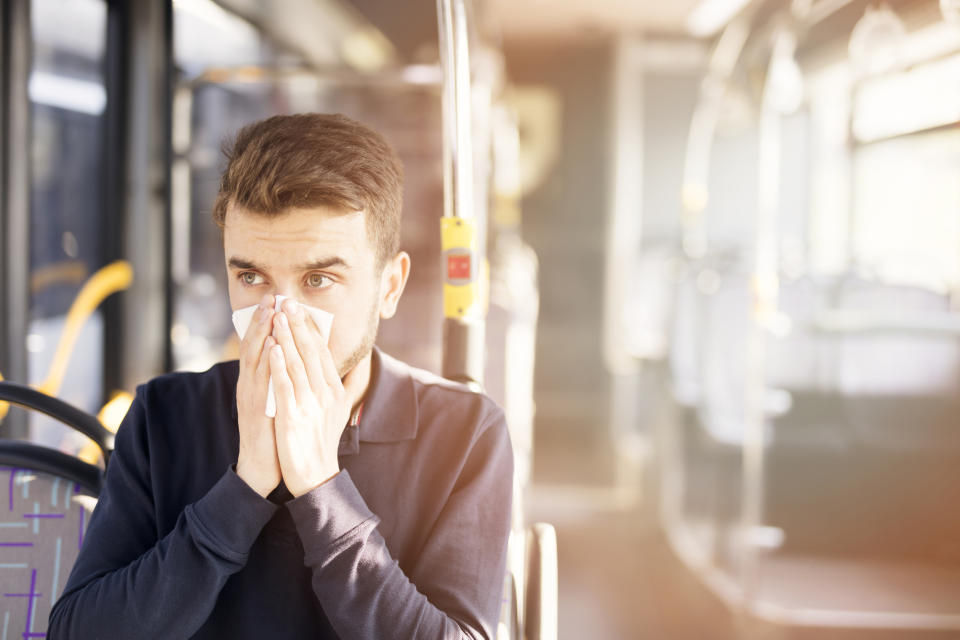 Should you move away from someone sneezing on your commute? (Getty)