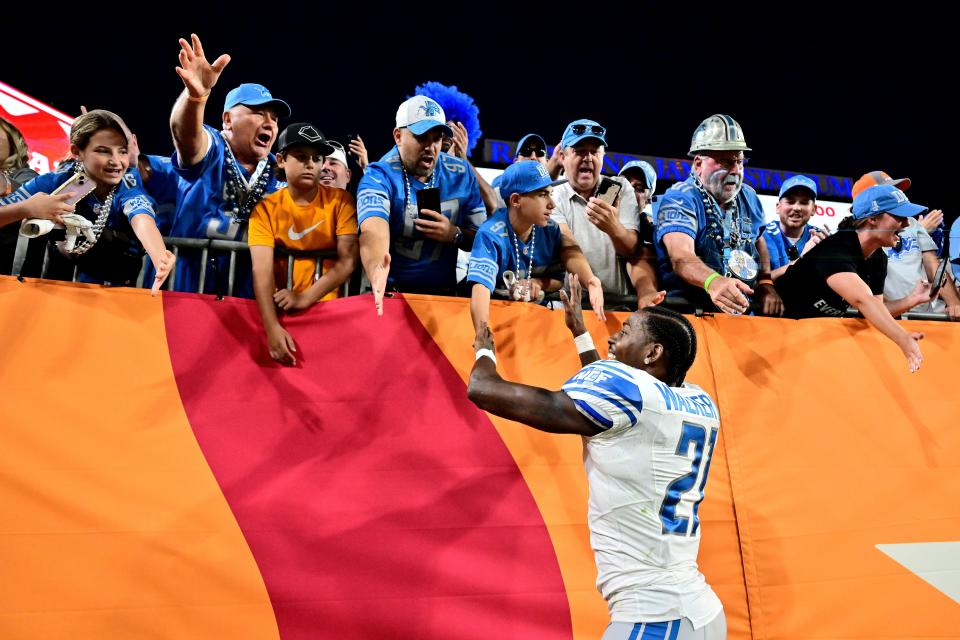 Tracy Walker III of the Detroit Lions high-fives fans after his team's 20-6 win against the Tampa Bay Buccaneers at Raymond James Stadium on October 15, 2023, in Tampa, Florida.