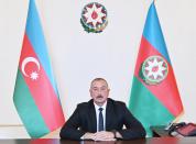 Azerbaijan's President Ilham Aliyev holds during an address to the nation in Baku