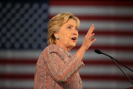 U.S. Democratic presidential nominee Hillary Clinton talks about climate change at a rally at Miami Dade College with former Vice President Al Gore in Miami, Florida, U.S. October 11, 2016. REUTERS/Lucy Nicholson