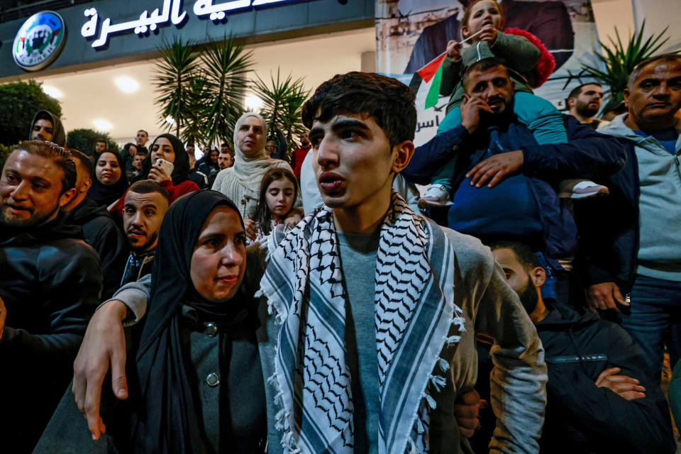 Image: A Palestinian prisoner, right, hugs a relative (Jaafar Ashtiyeh / AFP via Getty Images)