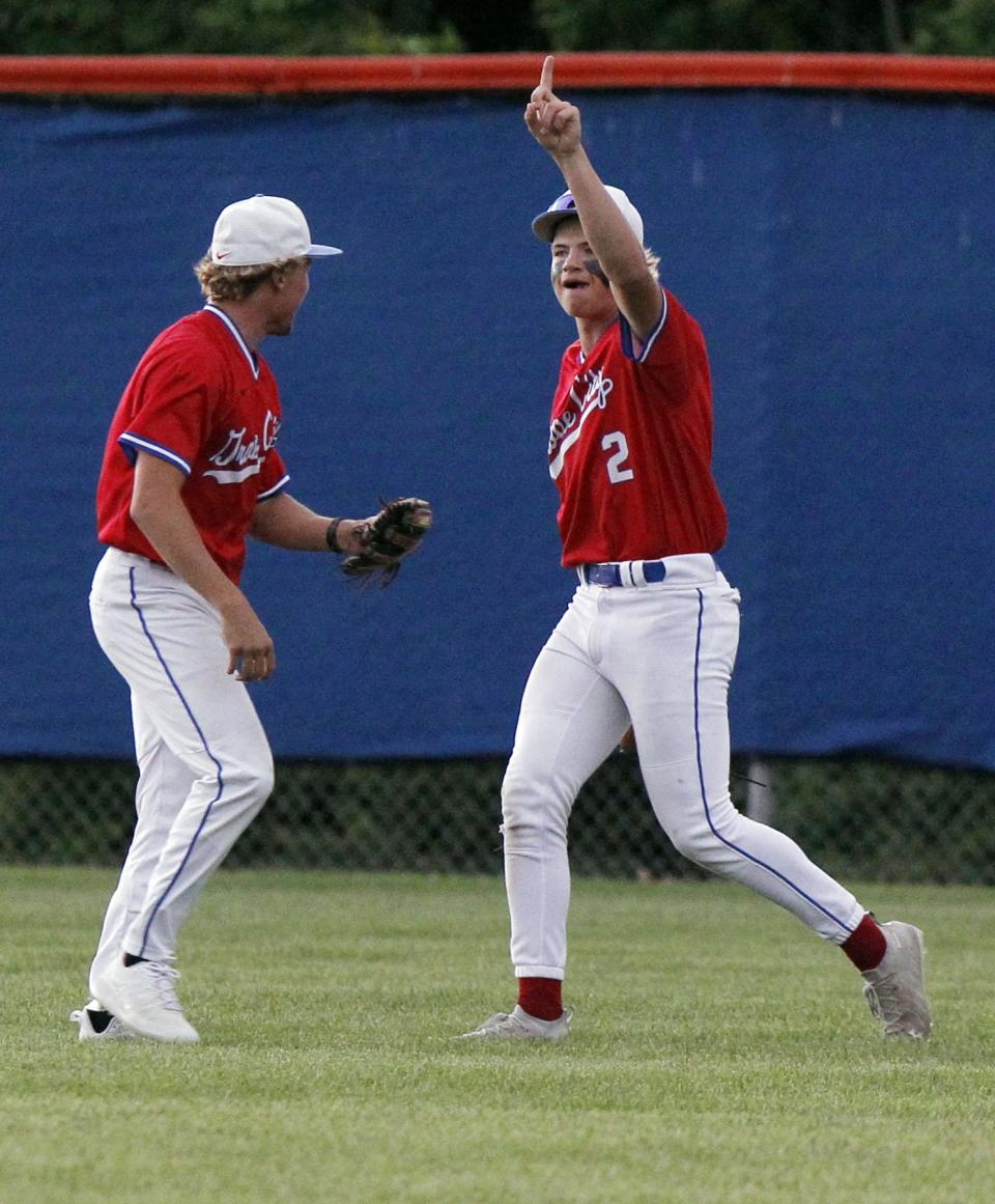 Grove City's Braxton Bryant, left, and Dennis Ritlinger-Nirider celebrate after Ritlinger-Nirider's diving catch during a Division I district final May 26 against Lancaster at Olentangy Orange. The game was scoreless in the sixth inning when it was suspended because of rain. The Greyhounds won 2-0 on May 28 at Upper Arlington.