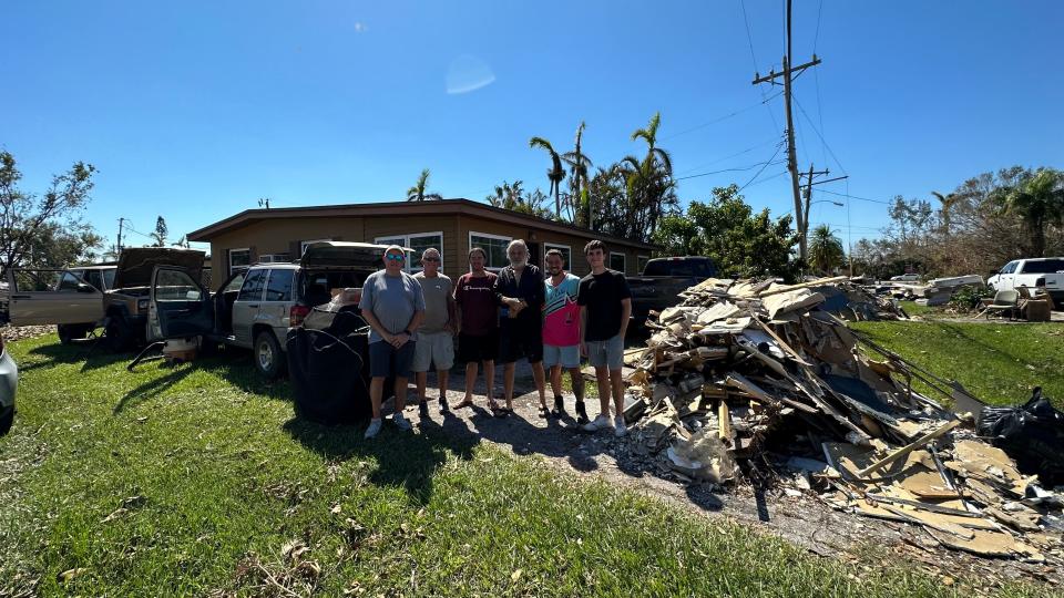 Mariana Matano's uncle David Grimes with friends and family outside in Fort Meyers, Florida.