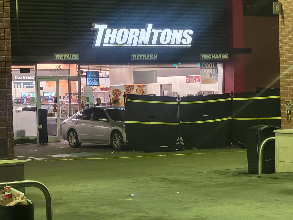 Police respond to a fatal shooting at the downtown Thornton's Sunday, June 12.