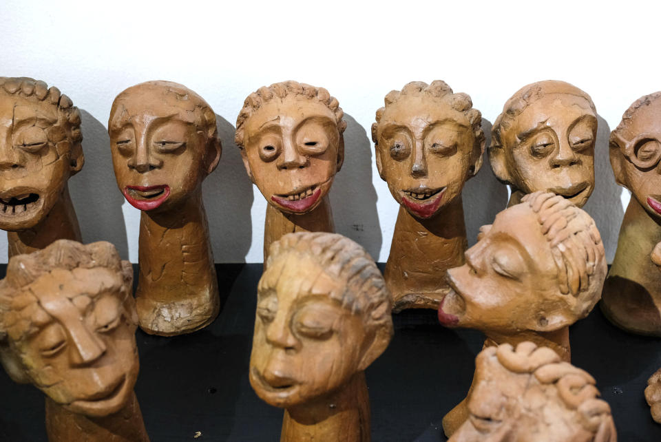 Lilian Nabulime's clay sculpture pieces exhibited during the "Olugamba exhibition at Xenson Art Space in Kamwokya, Kampala, the capital of Uganda, Tuesday Nov. 28 2023.Lilian Nabulime hasn't forgotten the time in the 1990s when the Ugandan capital had just one commercial art gallery, a small space that emerging artists struggled to get into. Now there are at least six in Kampala, including one whose curators recently exhibited the sculptor's contrarian work. (AP Photo/Hajarah Nalwadda.)