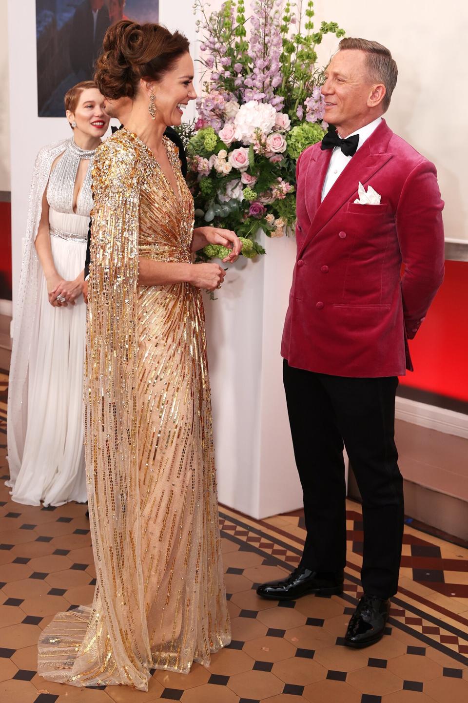 Kate Middleton and Daniel Craig Catherine, Duchess of Cambridge meets some of the cast including Daniel Craig at the "No Time to Die" World Premiere at Royal Albert Hall on September 28, 2021 in London