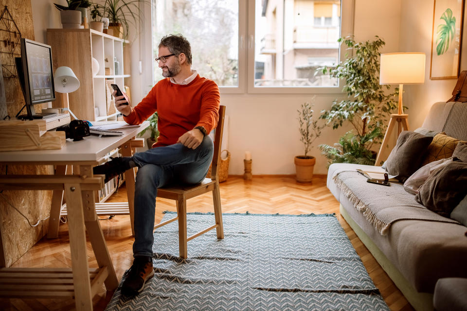 Texting while working from home office setup