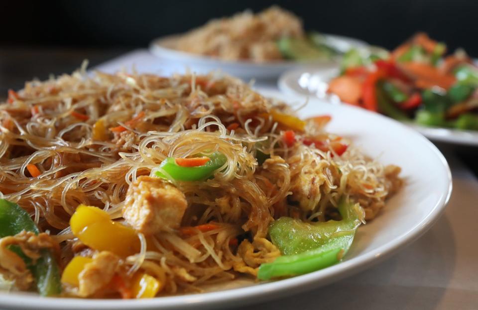 Singapore noodles with tofu, Malay fried black pepper salmon and chicken fried rice at Live Mon Thai-Malay restaurant.