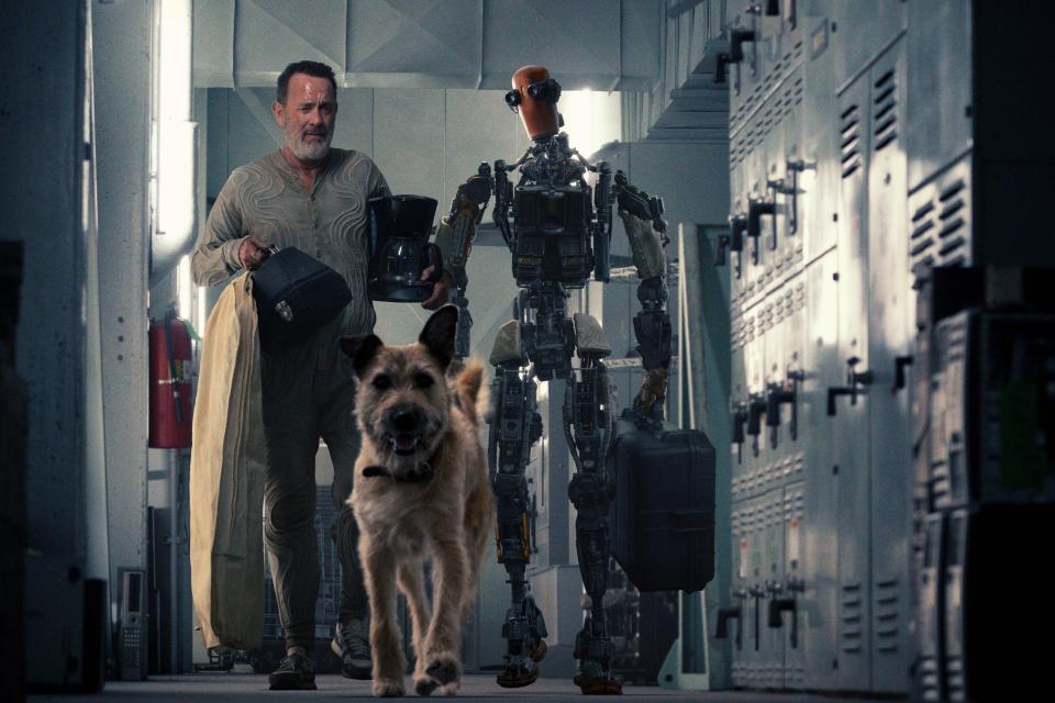 Finch (Tom Hanks) and robot Jeff (voiced by Caleb Landry Jones) hit the road with dog Goodyear in the post-apocalyptic sci-fi movie "Finch."