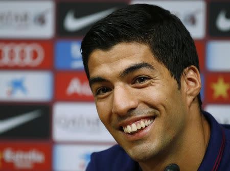 Luis Suarez makes Atletico Madrid smile