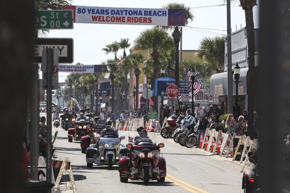 Bikers ride up and down Main Street in Daytona, Fla., during the starting day of Bike Week on Friday, March 5, 2021. (Sam Thomas/Orlando Sentinel via AP)