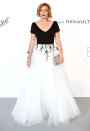 <p>Who’s that lady? Lindsay Lohan kept it classy for the 2017 Cannes amfAR Gala in a demure black-and-white gown. The <em>Mean Girls</em> star completed her look with a simple pearl choker, silver clutch, and bold red lips. (Photo: Mike Marsland/WireImage) </p>