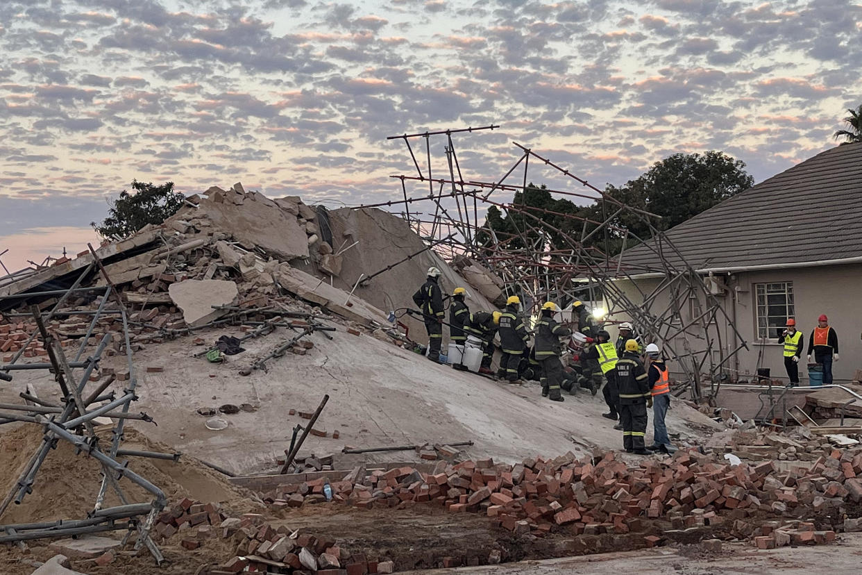 Rescue workers at the scene of a collapsed building in George, South Africa, May 7, 2024. / Credit: WILLIE VAN TONDER/AFP/Getty