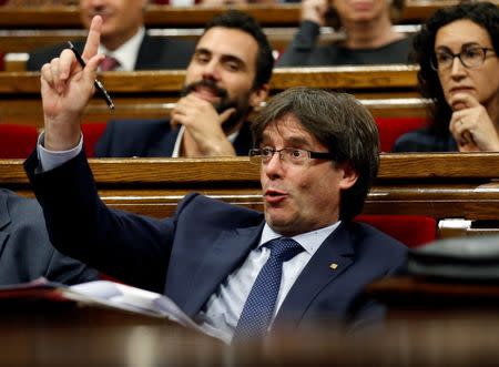 Catalonia's President Carles Puigdemont gestures during a confidence vote session at Catalan Parliament in Barcelona, Spain September 29, 2016. REUTERS/Albert Gea