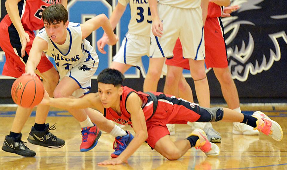 Sisseton's Jeremias Perez dives in an attempt to steal the ball from Florence-Henry's Carson Vavruska during their high school boys basketball game on Thursday, Feb. 15, 2024 in Florence. Florence-Henry won 56-34.