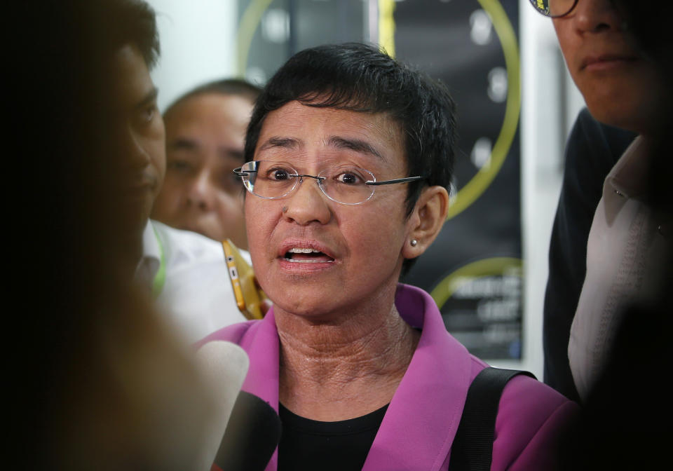 FILE - In this Jan. 22, 2018, file photo, Maria Ressa, CEO of the online news agency Rappler, talks to the media after attending the summons by the National Bureau of Investigation on the cyber libel complaint filed against Rappler five years ago in Manila, Philippines. Philippine authorities have arrested Ressa, Wednesday, Feb. 13, 2019, over a libel complaint which Amnesty International has condemned as "brazenly politically motivated." (AP Photo/Bullit Marquez, File)