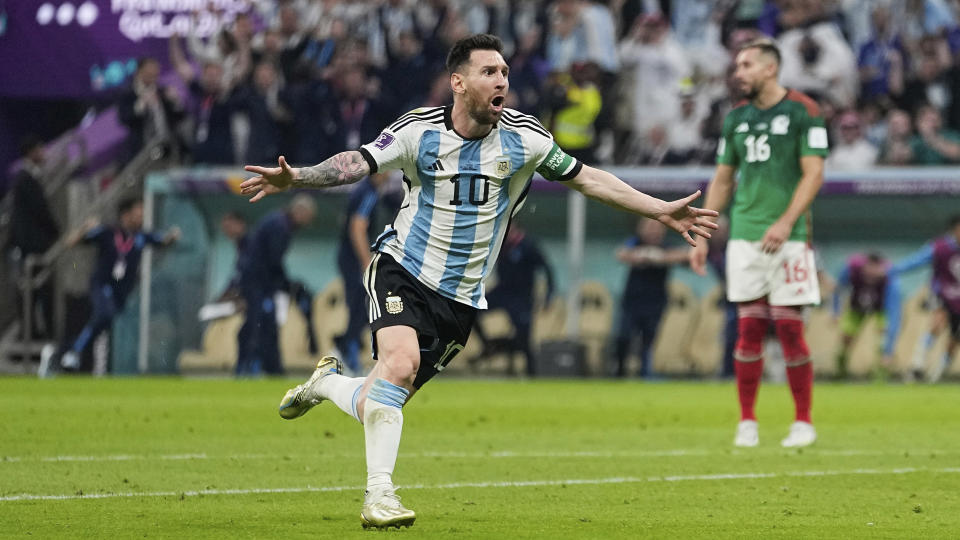 Argentina's Lionel Messi celebrates after scoring his side's first goal during the World Cup group C soccer match between Argentina and Mexico at the Lusail Stadium in Lusail, Qatar, Saturday, Nov. 26, 2022. (AP Photo/Ariel Schalit)