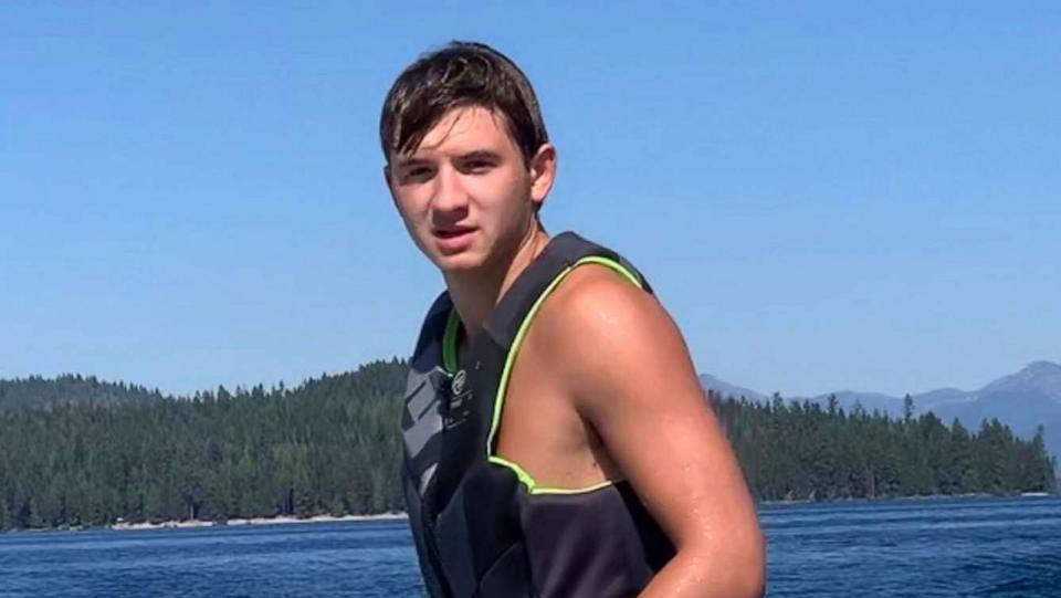 PHOTO: Ethan Chapin surfs on Priest Lake in northern Idaho in this family photo from July 2022.  (Courtesy Stacy Chapin via AP)