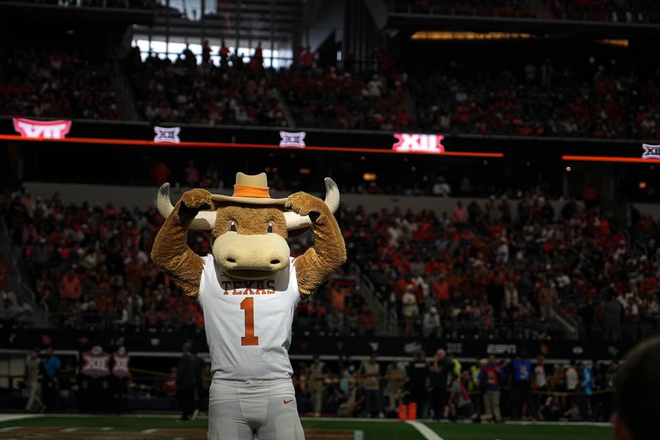 Texas mascot HookEm hypes up Longhorns fans during Saturday's 49-21 win over Oklahoma State at the Big 12 Championship Game at AT&T Stadium in Arlington. The Longhorns found out Sunday that they qualified for the four-team College Football Playoff field.