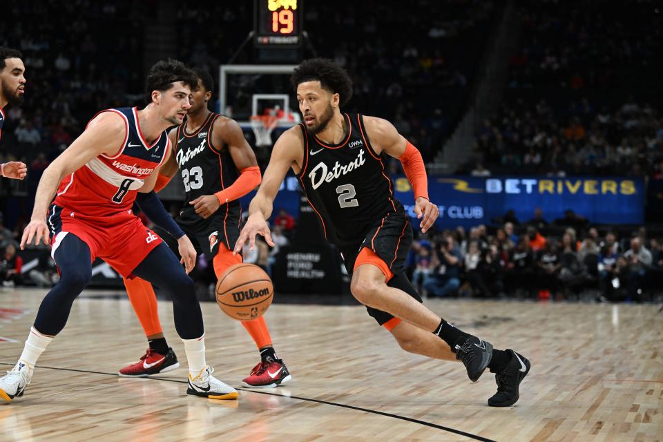Detroit Pistons guard Cade Cunningham drives to the basket against Washington Wizards forward Deni Avdija in the first quarter at Little Caesars Arena, Jan. 27, 2024.
