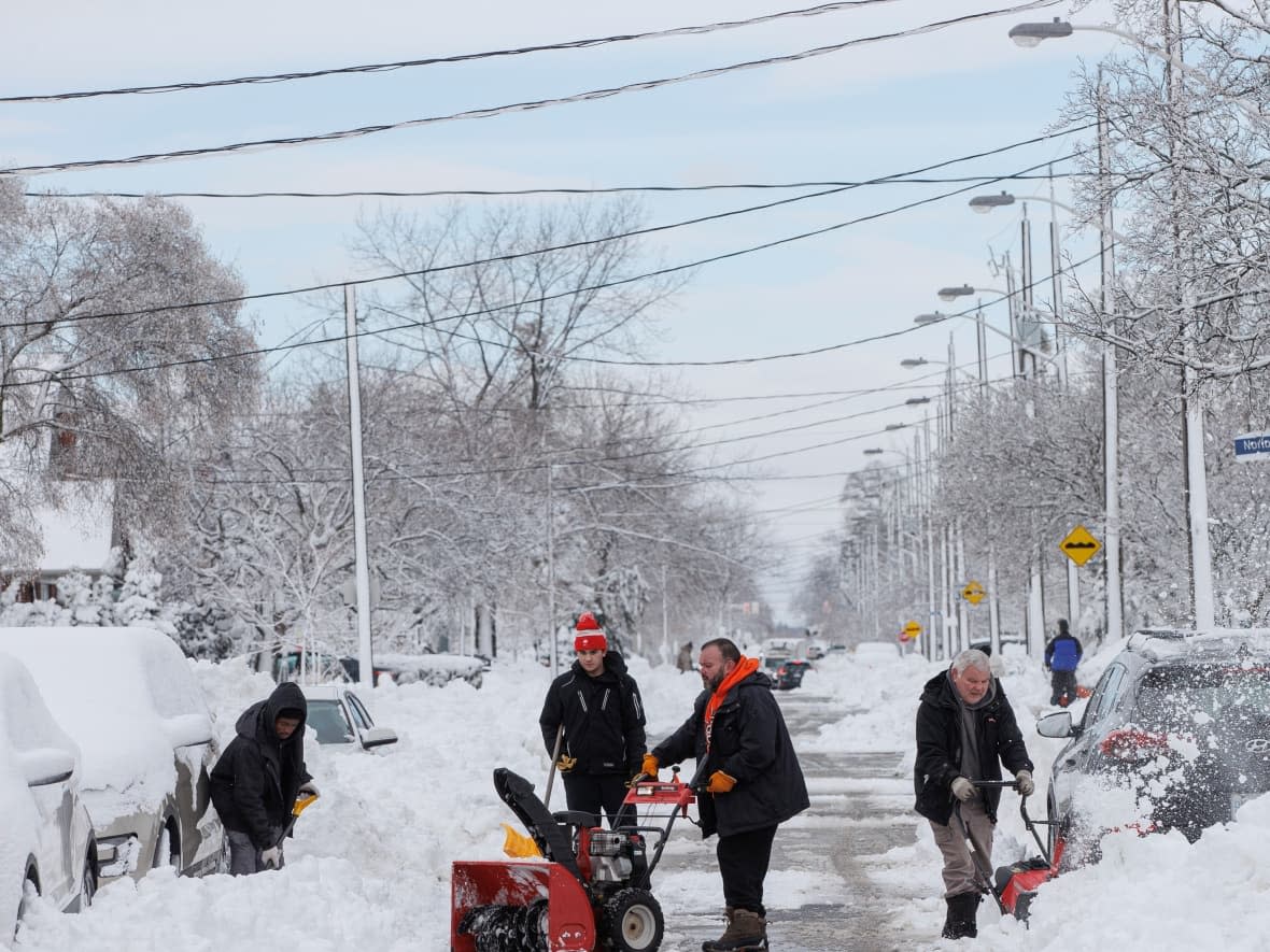 Torontonians dig out on March 4, 2023 after a night of heavy snowfall. (Evan Mitsui/CBC - image credit)