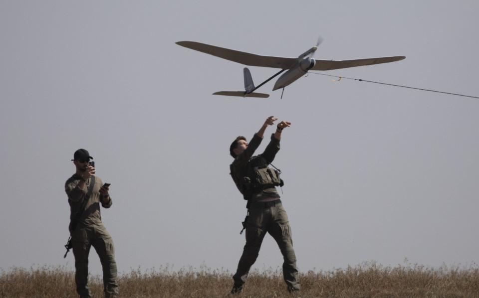 Israeli soldiers launch a reconnaisance drone from southern Israel