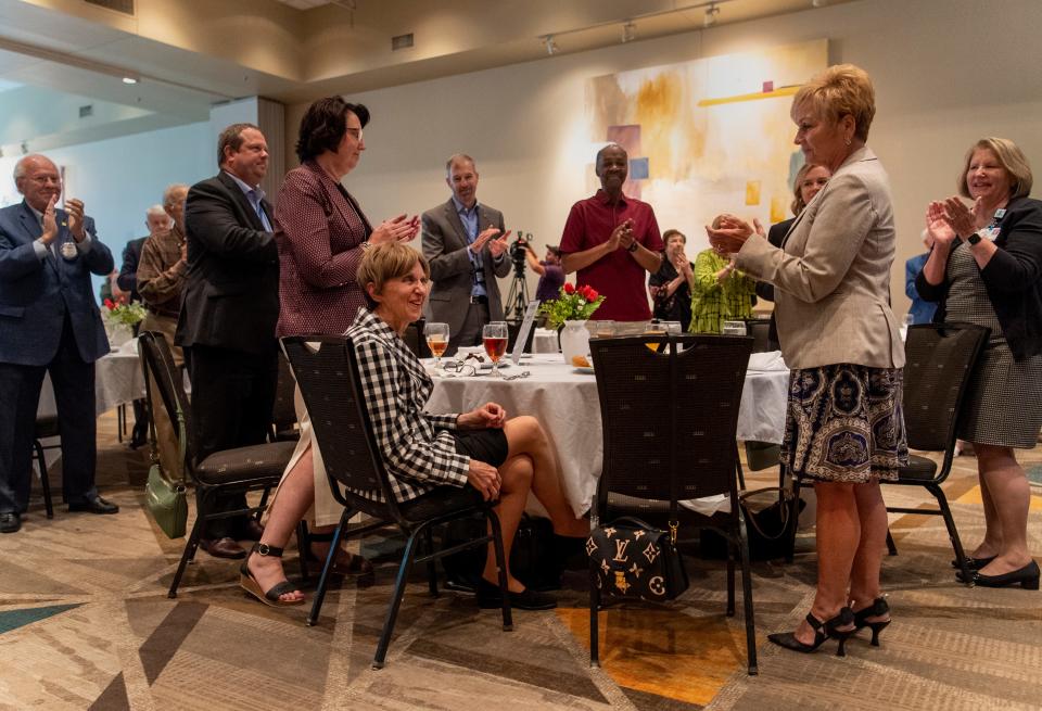 Attendees stand in applause as Linda E. White, center, is honored with the 2022 Rotary Club of Evansville's Civic Award at Bally's Evansville Conference Center in Downtown Evansville, Ind., Tuesday afternoon, June 13, 2023.