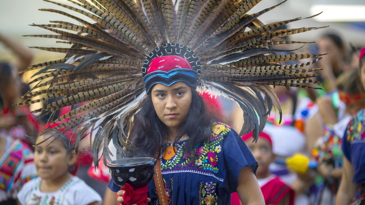 A student of Anahuacalmecac International University Preparatory of North America school for indigenous students holds incense during an event celebrating Indigenous Peoples Day in the Hollywood area on October 8, 2017 of Los Angeles, Californiaa. The event is a celebration of the Los Angeles County's decision to replace Columbus Day with Indigenous Peoples Day. Both the city and the county of Los Angeles have approved the replacement on each second Monday in October, starting no later than 2019.